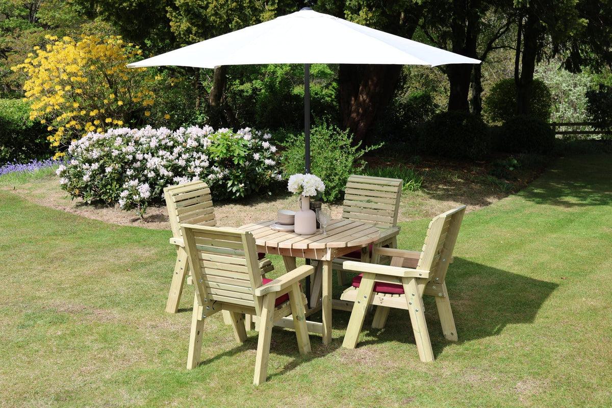 Heritage round 4 seat dining set beneath a parasol