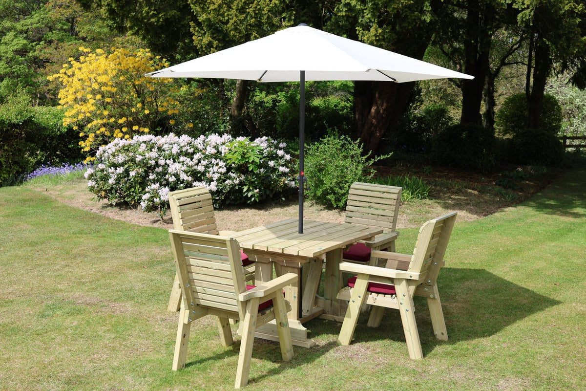 Heritage square table set with four cushioned chairs and parasol