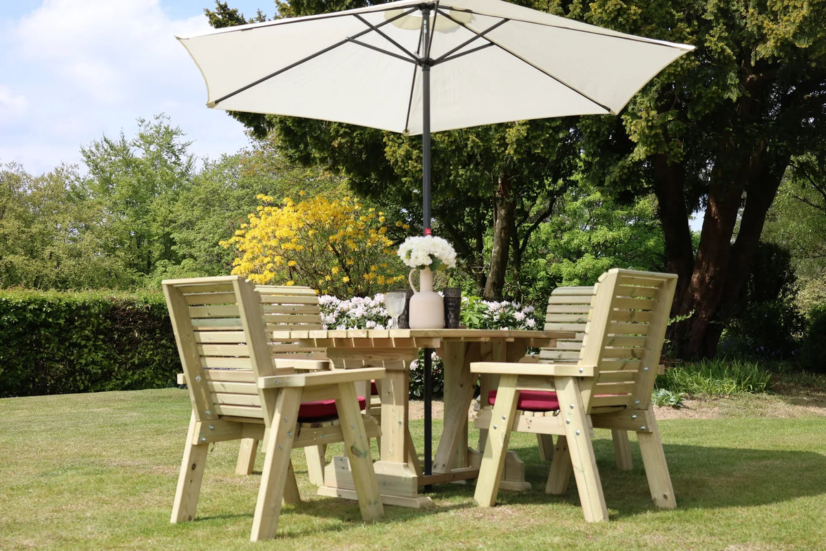 Heritage four seat square table dining set beneath a parasol