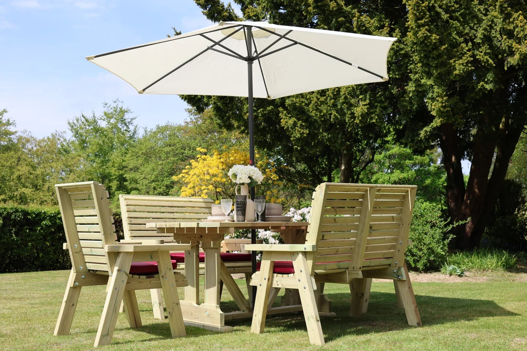 Heritage Tanalised 6 seat garden dining set styled with cushions and parasol