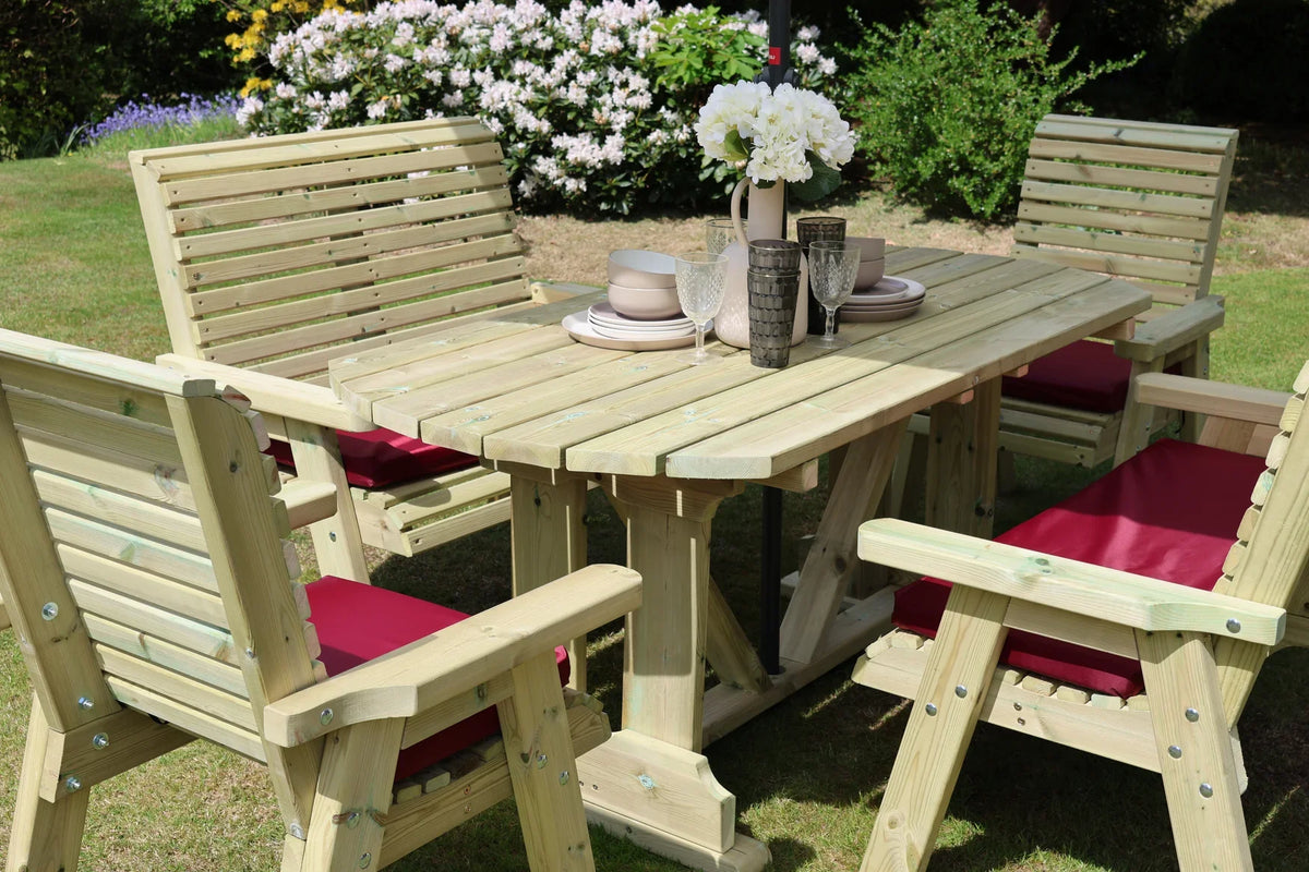 Close view of Heritage Tanalised dining table, two chairs and two benches