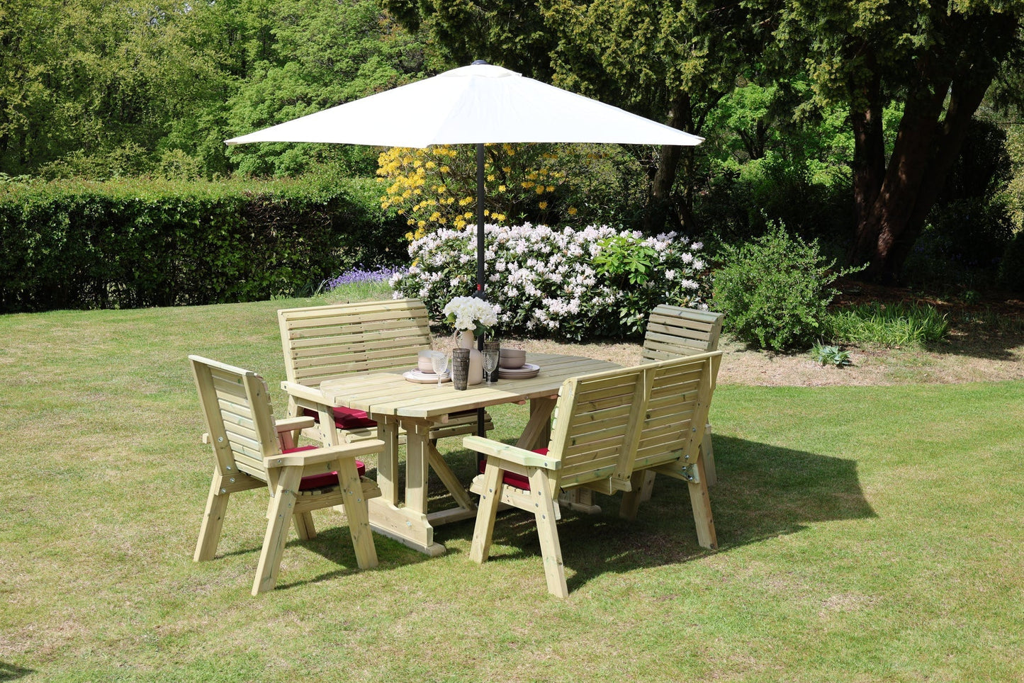 Wide garden view of Heritage Tanalised six seat dining set with chairs and benches