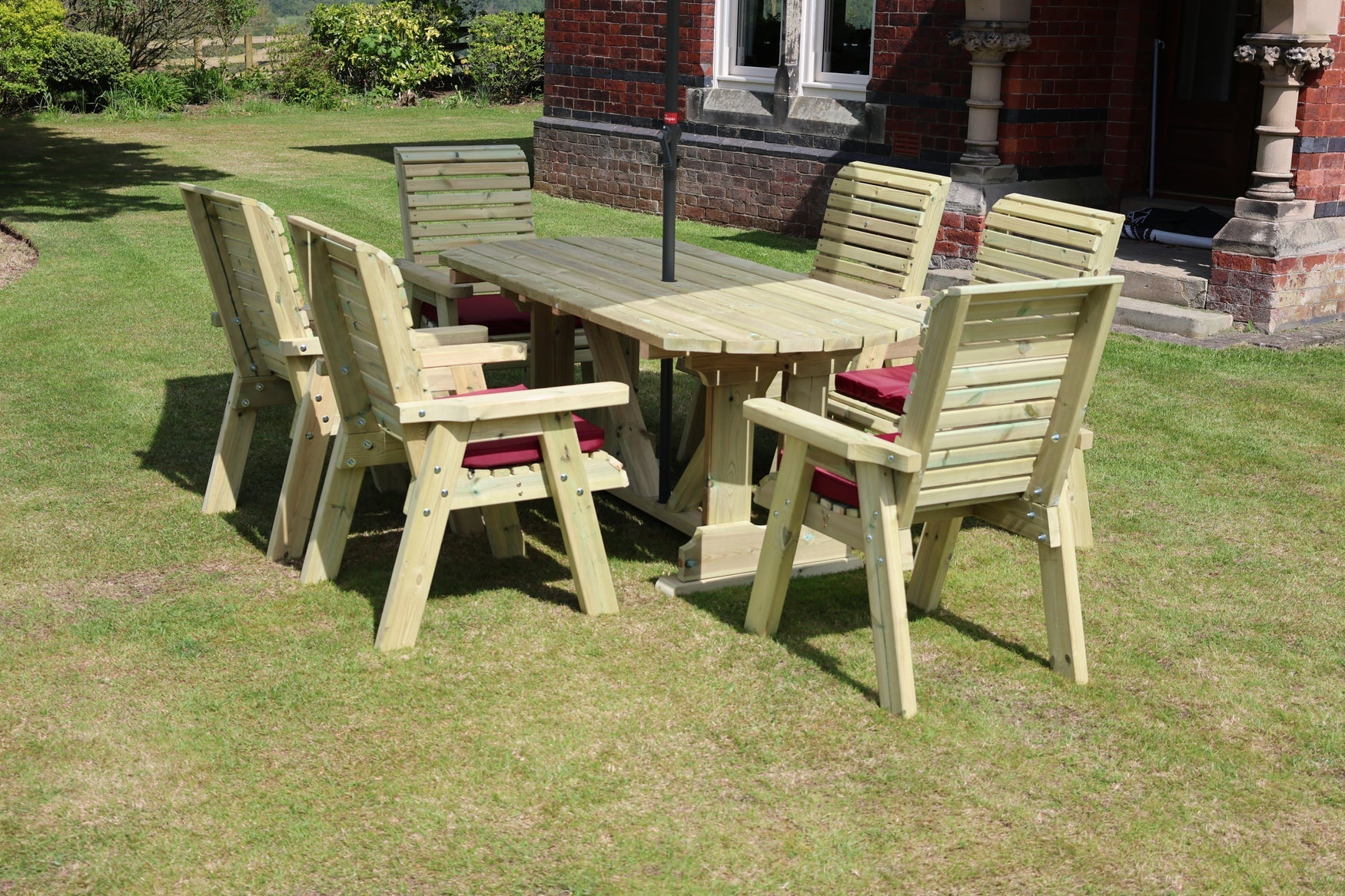 Angled view showing the Heritage Tanalised rectangular table and six armchairs