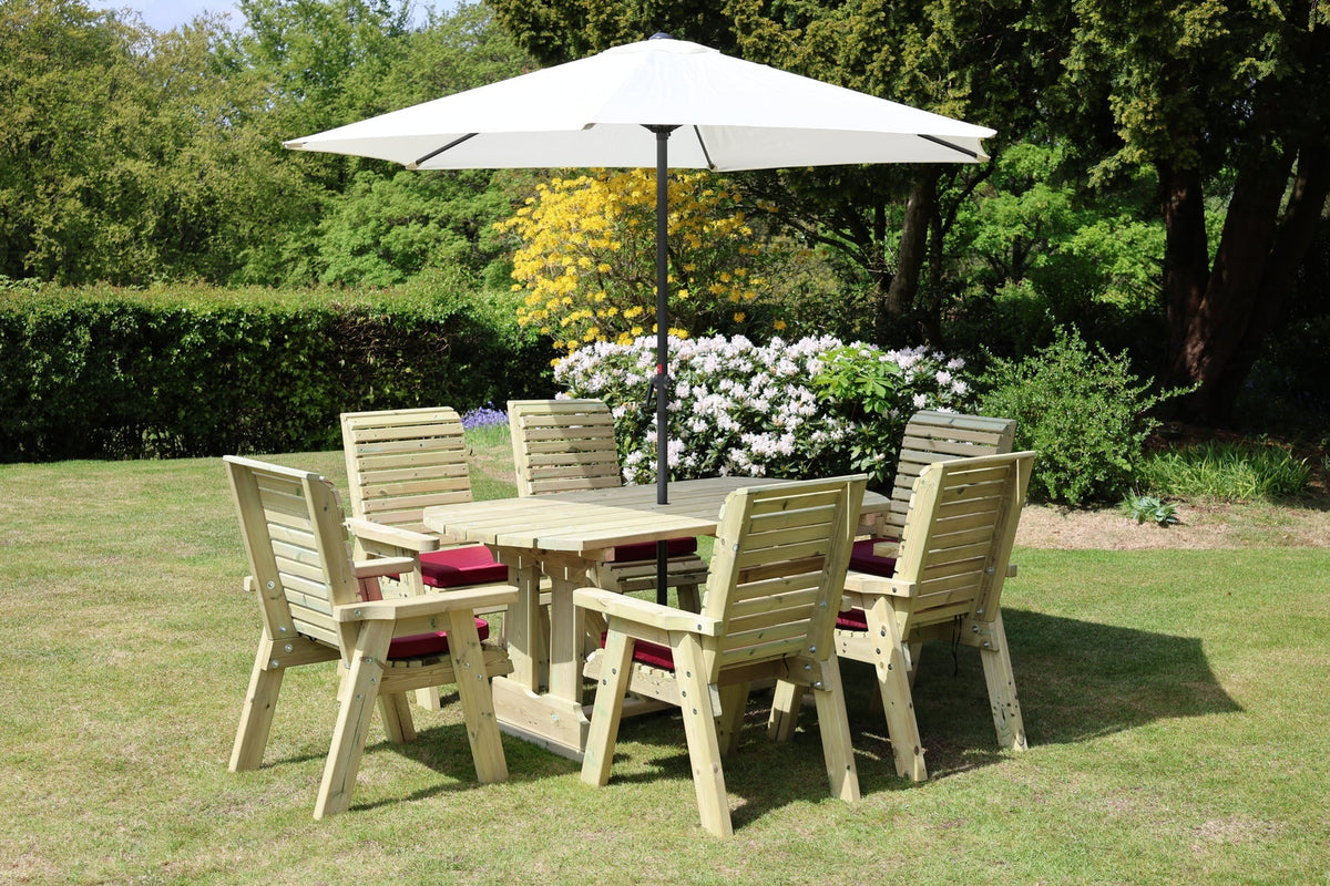 Heritage Tanalised six chair rectangular dining set in a garden with parasol