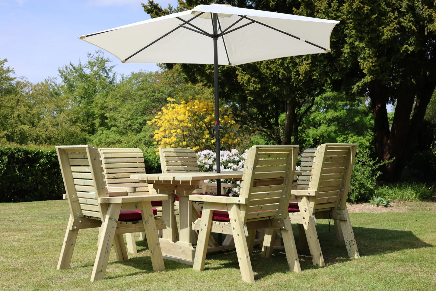 Low angled view of Heritage Tanalised rectangular dining set with six cushioned chairs
