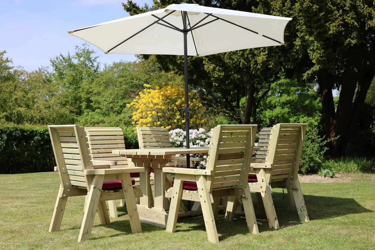 Low angled view of Heritage Tanalised rectangular dining set with six cushioned chairs