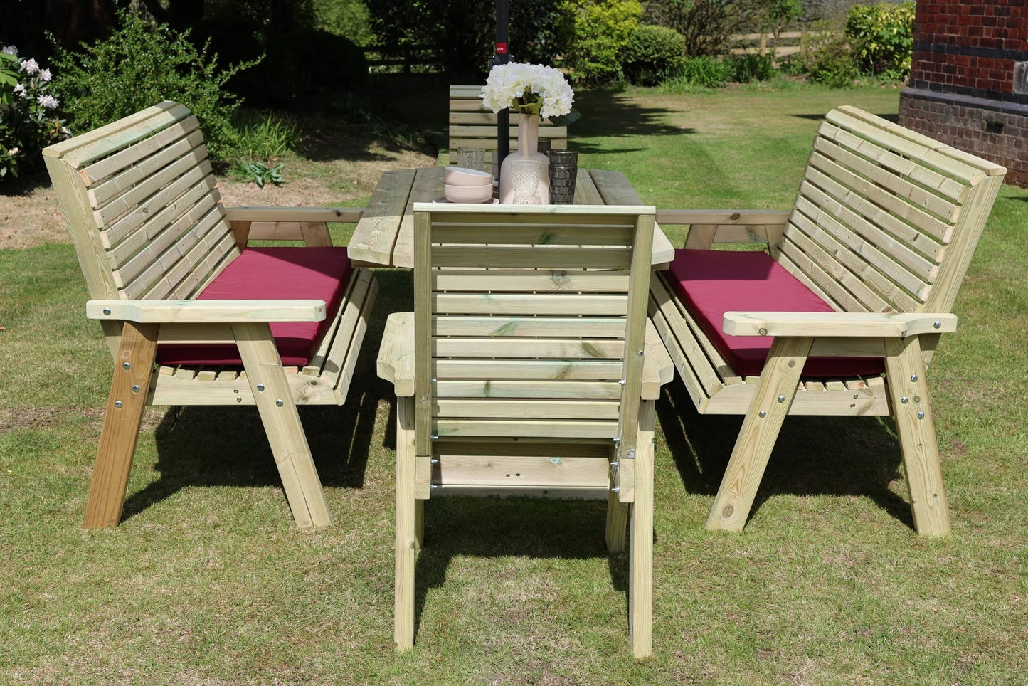 End view showing two three-seat benches and two chairs around a rectangular table