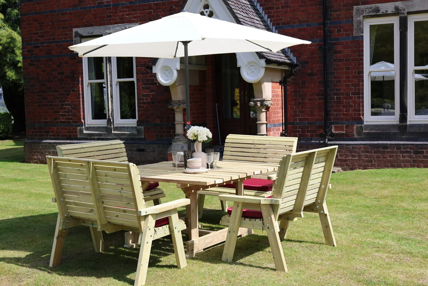 Heritage Tanalised square table with four two-seat benches in a garden setting