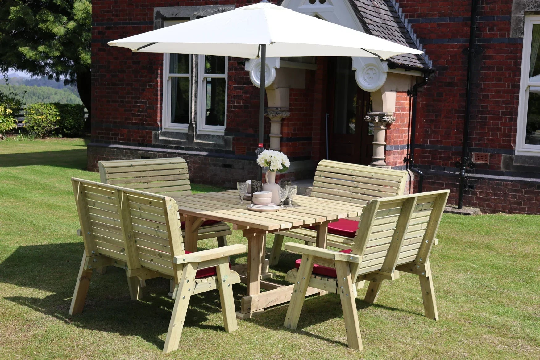 Heritage Tanalised square dining set with four cushioned benches and parasol