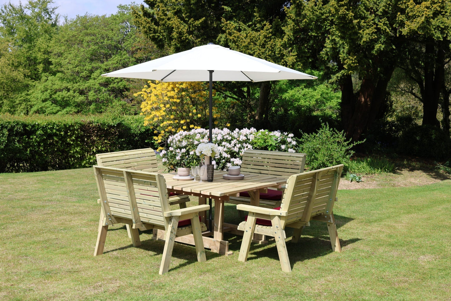 Wide garden view of Heritage Tanalised eight seat square dining set with benches
