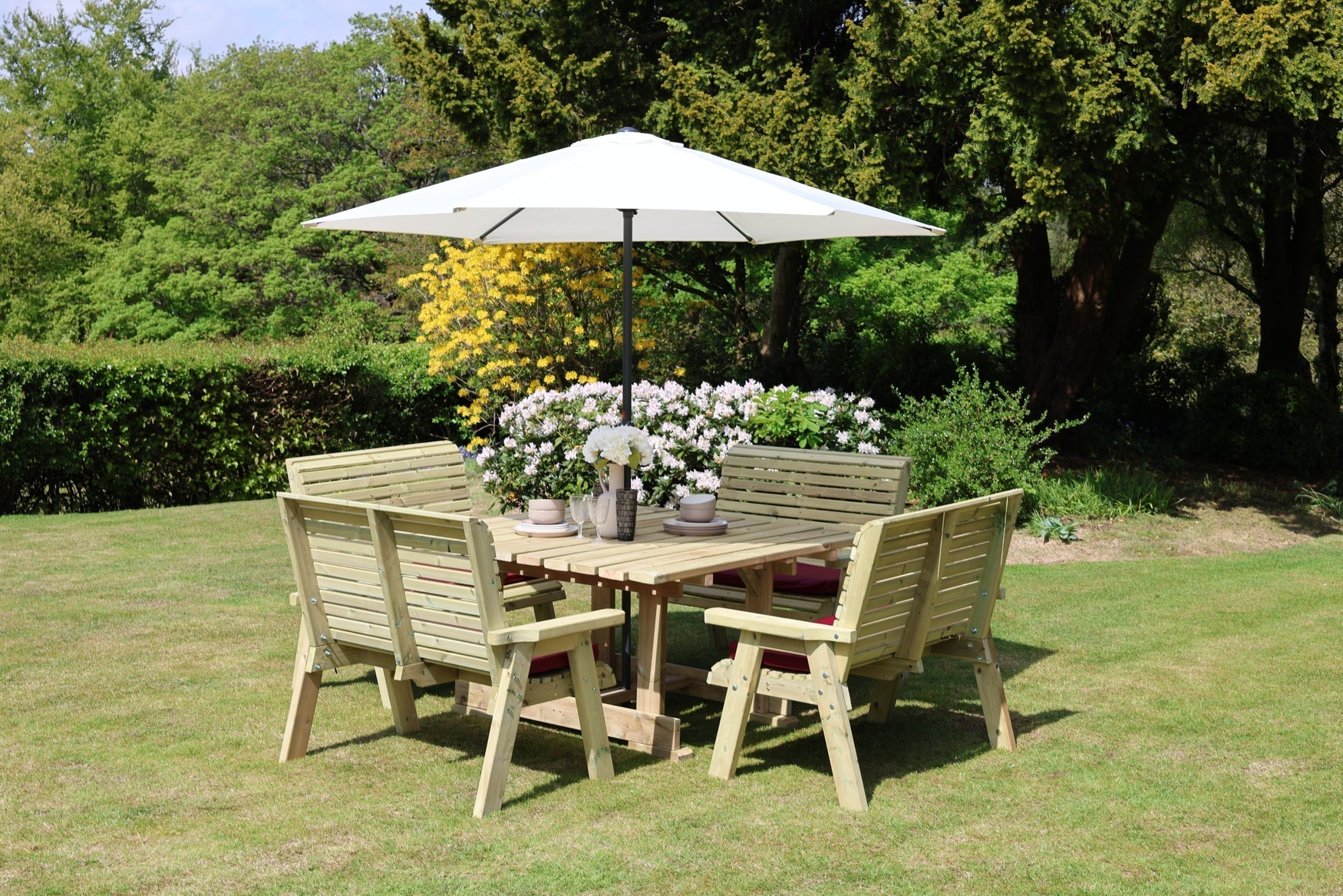 Wide garden view of Heritage Tanalised eight seat square dining set with benches