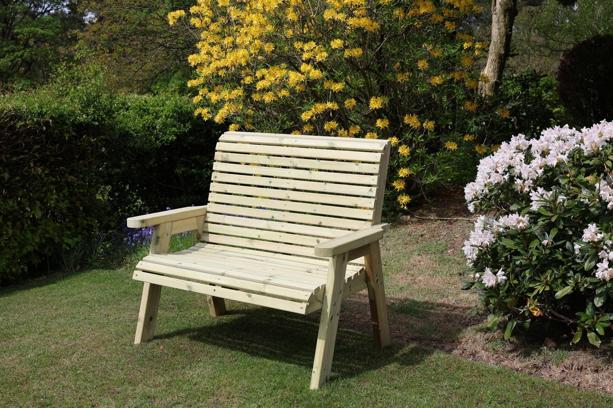 Heritage Tanalised 2 seat bench in a garden