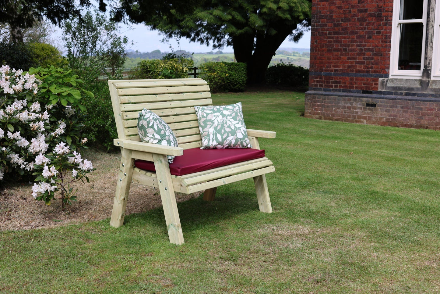 Heritage Tanalised wooden garden bench with cushion and pillows