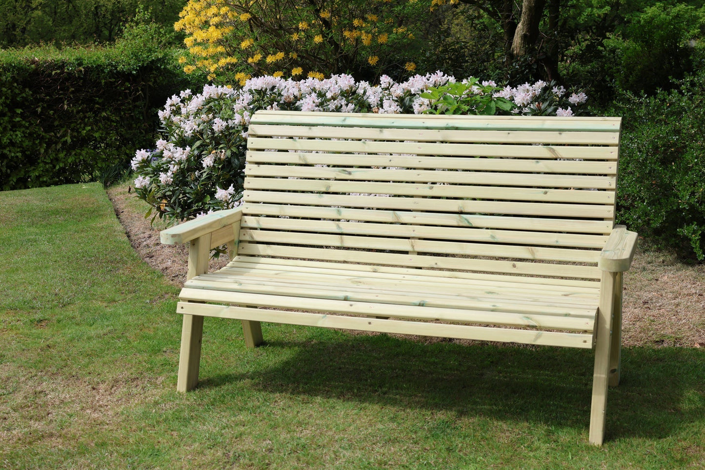 Heritage Tanalised 3 seat bench in a garden