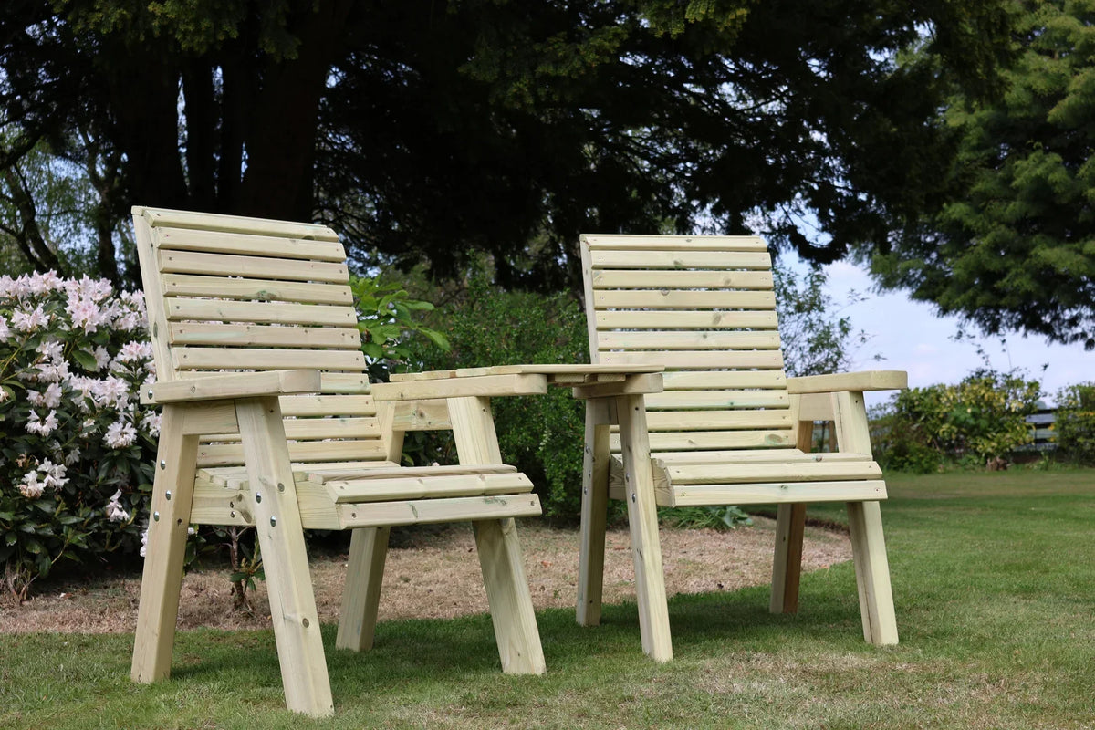 Heritage Tanalised angled garden loveseats viewed from a low angle