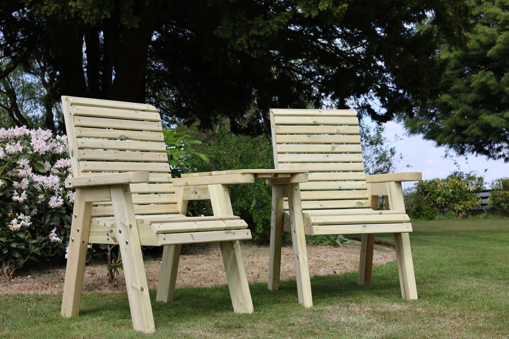 Heritage Tanalised angled garden loveseats viewed from a low angle