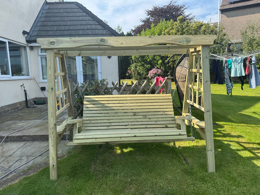 Lilly 3 seat wooden garden swing installed in a customer garden